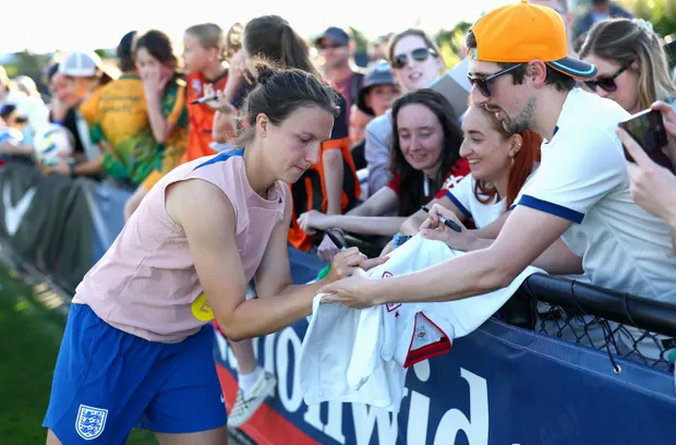 Lotte Wubben-Moy signs a shirt after an England training session at the Sunshine Coast Stadium.