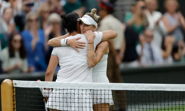 Marketa Vondrousova hugs Ons Jabeur after winning the Wimbledon title.