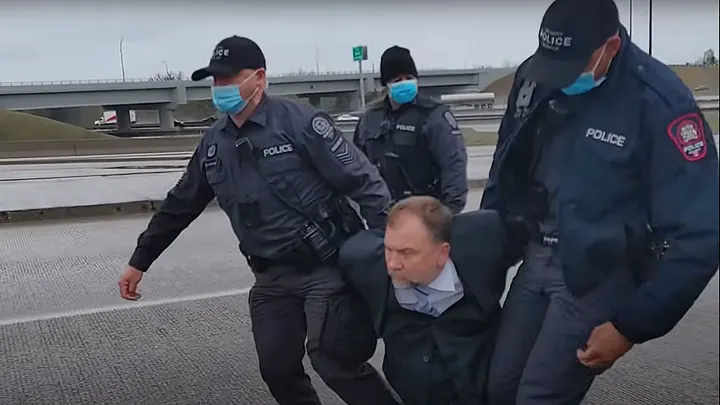 Pastor Artur Pawlowski is arrested by Calgary Police in the middle of a highway on his way home from church