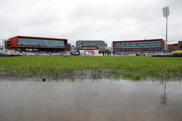 Puddles near the pitch as rain falls during day four.