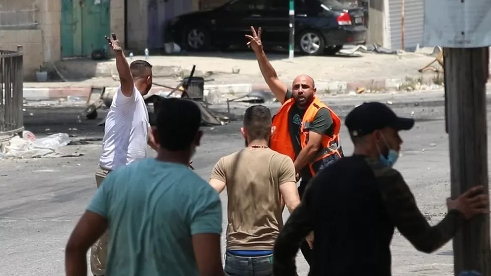 paramedics and bystanders rushing to Abdul Rahman Hardan's aid moments after was shot