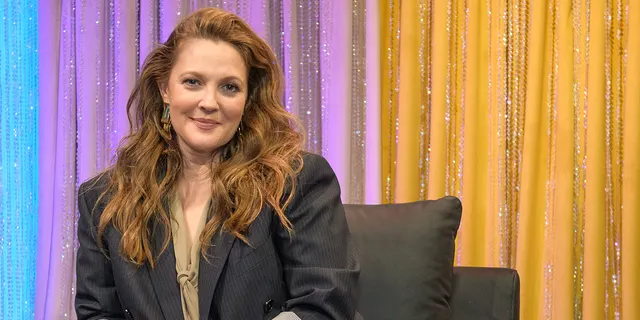 Drew Barrymore escorted off stage being verbally accosted by fan