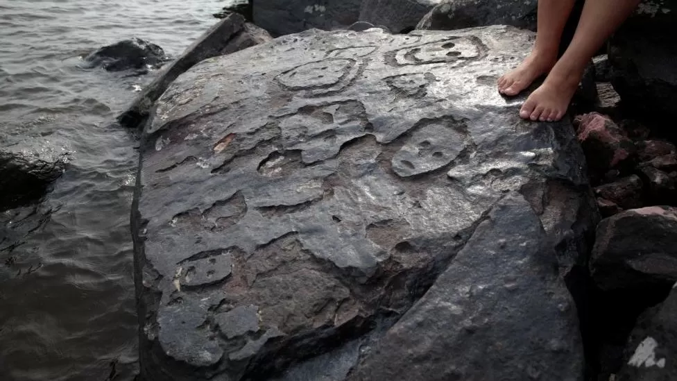 Brazil drought reveals ancient rock carvings of human faces