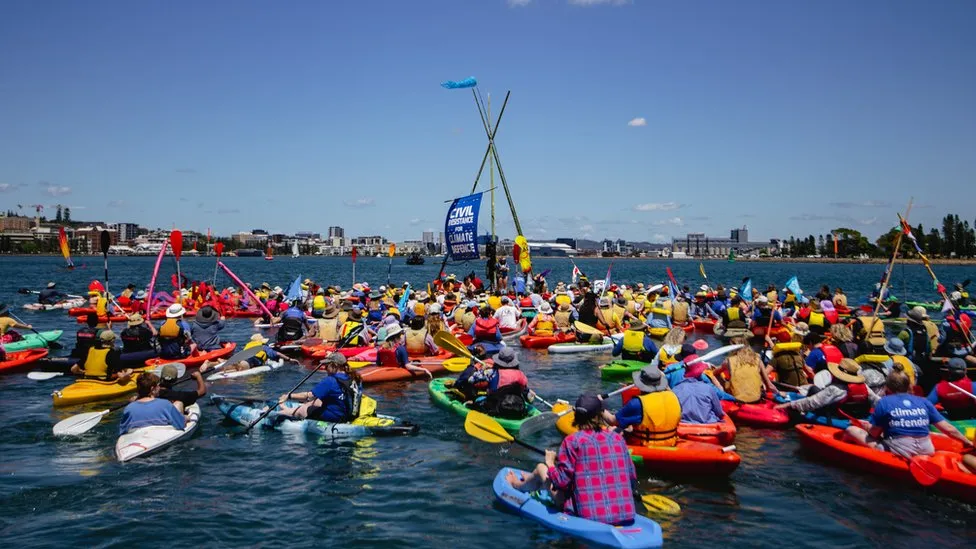 Climate protest more than 100 arrested at world’s largest coal port
