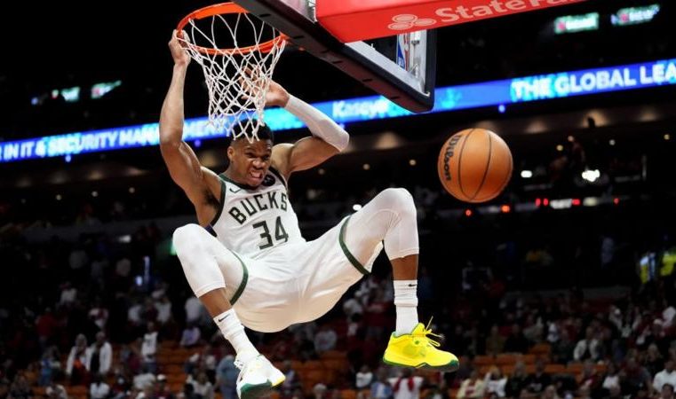 Giannis Antetokounmpo helps Milwaukee Bucks reach last eight.